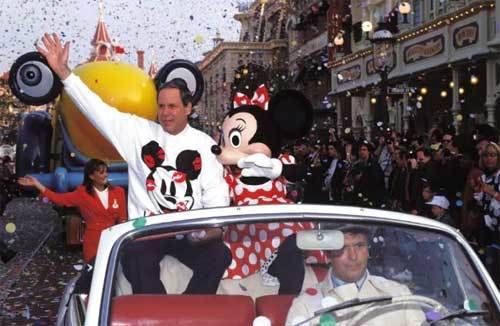 <p>Michael Eisner rides along with Minnie Mouse in the opening day parade at Euro Disneyland Park. </p>