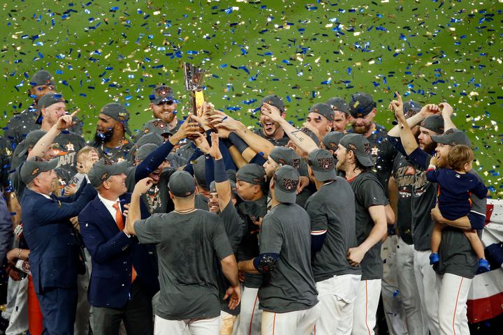 The Houston Astros celebrate after defeating the New York Yankees by a score of 4-0 to win game seven of the American League Championship Series at Minute Maid Park on Saturday, October 21, 2017 in Houston, Texas. (Photo by Bob Levey/Getty Images)
