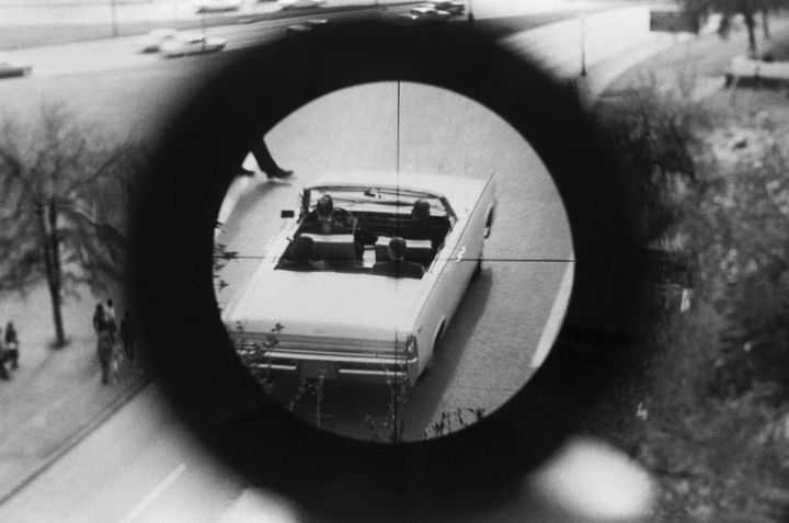 A view through a gun sight from the Texas School Book Depository is part of a reenactment of the Kennedy assassination. This evidence was submitted to the Warren Commission.