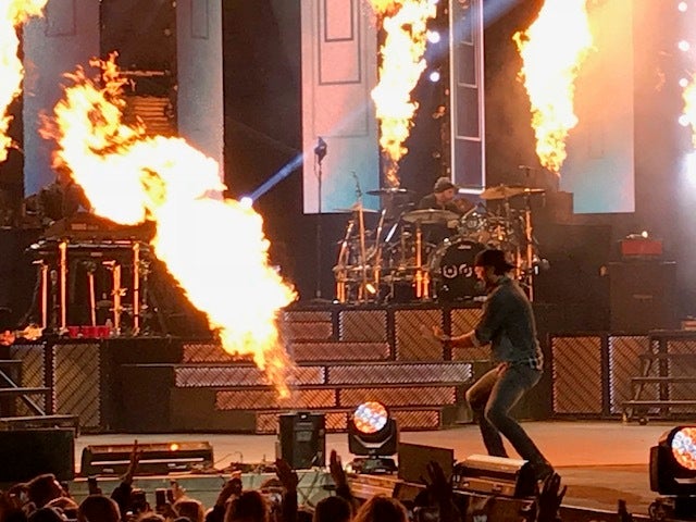 Luke Bryan singing “Kick The Dust Up”