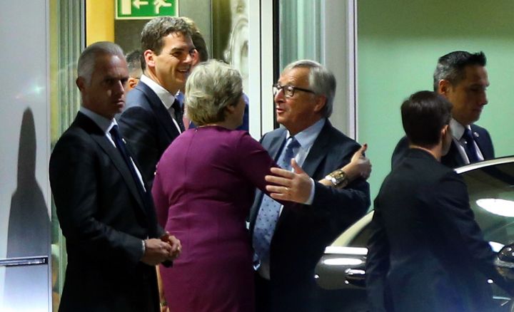 Jean-Claude Juncker sends off Theresa May after their meeting at the European Commission building in Brussels, Belgium on October 16, 2017. 