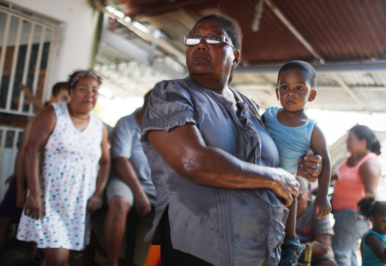 Americans in San Isidro, Puerto Rico, wait for FEMA to arrive with water. Their neighborhood has been without power or clean water for more than a month.