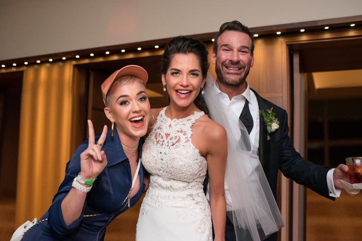 The bride and groom pose with Katy Perry herself.