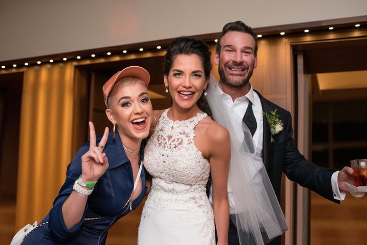 The bride and groom pose with Katy Perry herself.