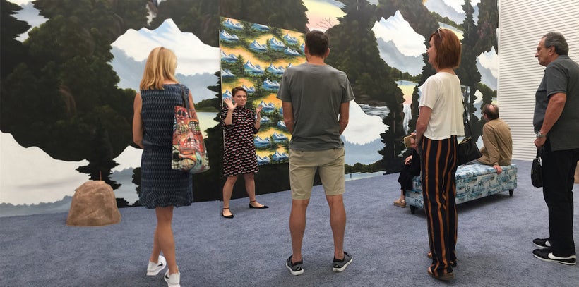 Anat Ebgi gives a walk-through of Neil Raitt’s exhibition, <em>Misty Rock</em>. Photo by Edward Goldman.