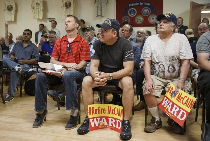Veterans listen as Kelli Ward speaks during a campaign stop at the Veterans of Foreign Wars Post 720 in Phoenix on Aug.&