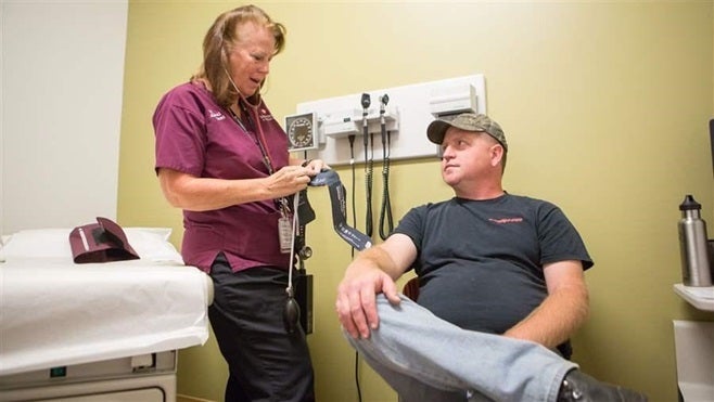 <p>Becky Peterson, a medical assistant, measures a patient’s blood pressure at the UCHealth clinic in Denver’s Lowry neighborhood. Medical assistants are taking on more responsibilities as the health care workforce changes.</p>