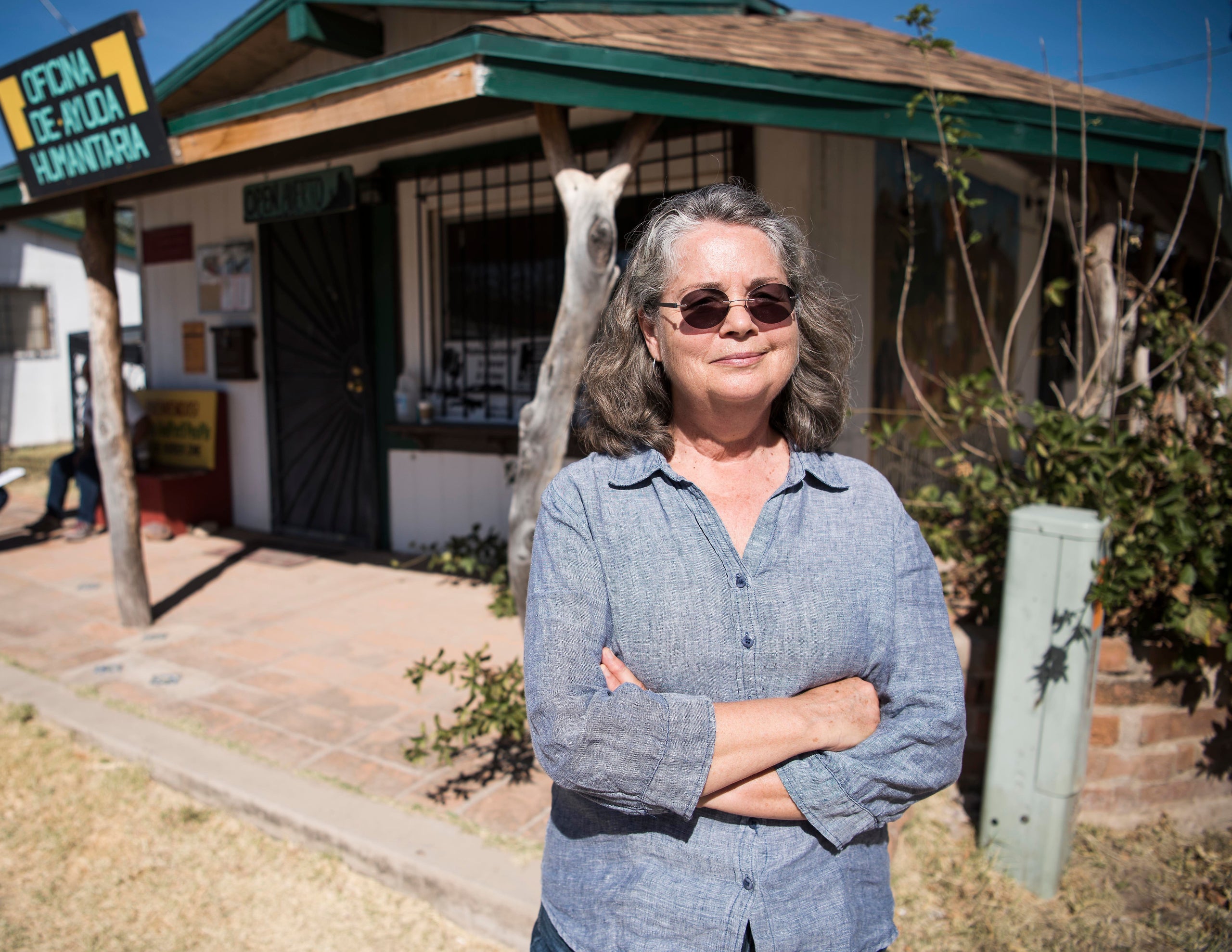 Leesa Jacobson stands outside the Arivaca Humanitarian Aid Office in Arivaca, Arizona.