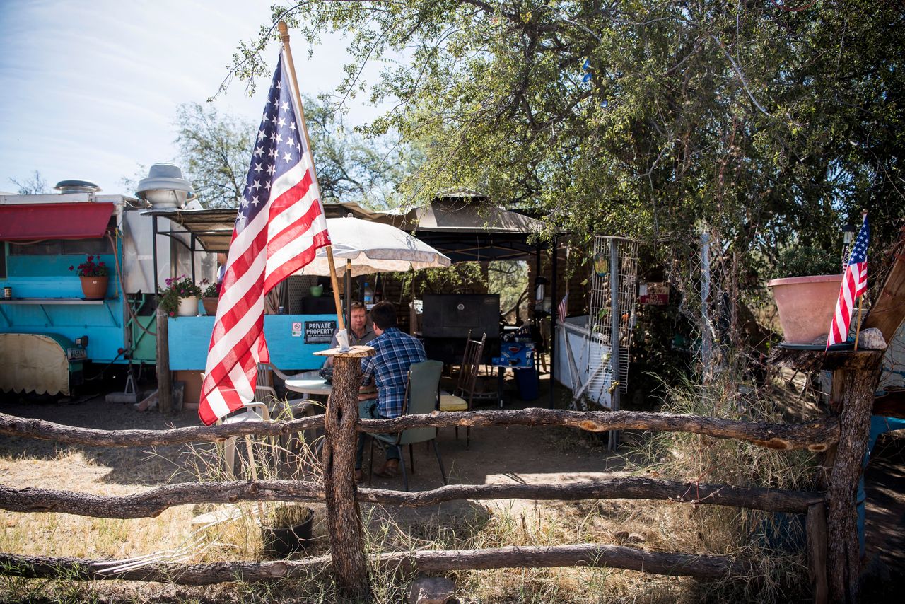 An American flag sits in front of the "La Rancherita" restaurant in Arivaca, Arizona. Some residents of the small town want to do everything they can to help people who are crossing the border. But not everyone agrees with that effort.
