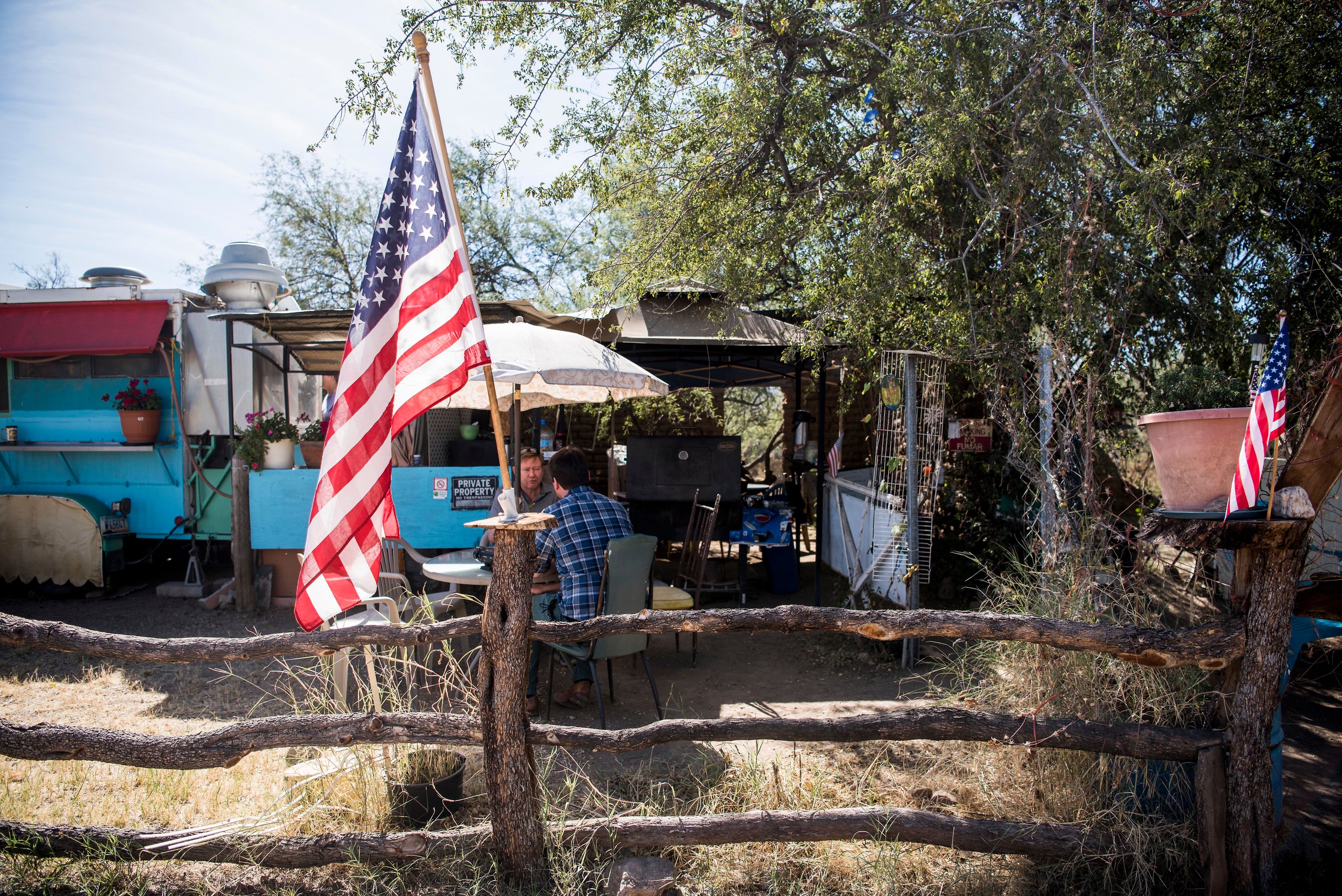 An American flag sits in front of the "La Rancherita" restaurant in Arivaca, Arizona. Some residents of the small town want t