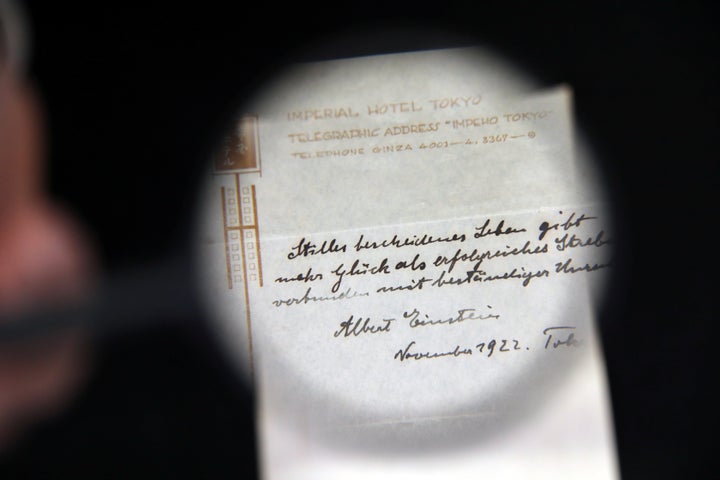 <strong>A note he hastily scrawled to a bellboy in Tokyo has sold at auction for £1.19m </strong>