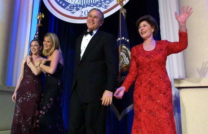 United States President George W. Bush (C), his wife Laura, and daughters Jenna and Barbara, attend the first inaugural ball
