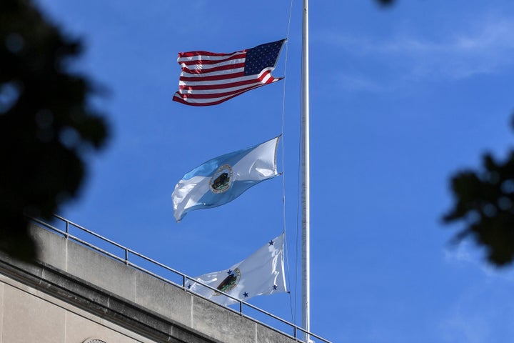 The flag for the Interior Department's deputy secretary, bottom, flew last week above agency headquarters building in downtown Washington. The middle flag represents the department as a whole.