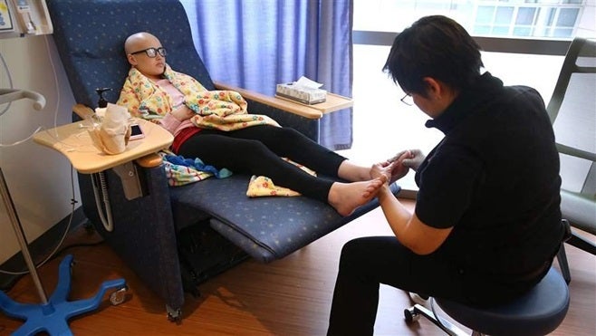 A patient receives massage therapy at the Dana-Farber Cancer Institute in Massachusetts. The state’s Medicaid program is seek