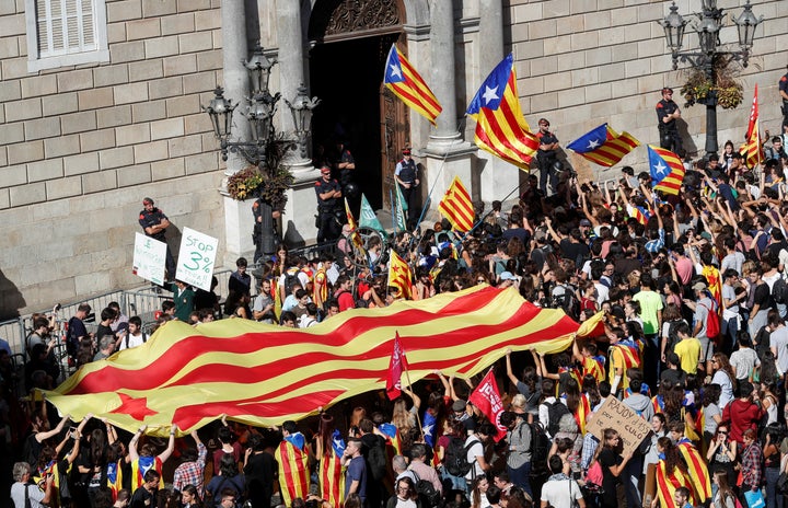 Protestors carrying Catalan seperatist flags gather outside the Generalitat Palace, the regional government headquarters, in Barcelona, Spain, October 26, 2017. 