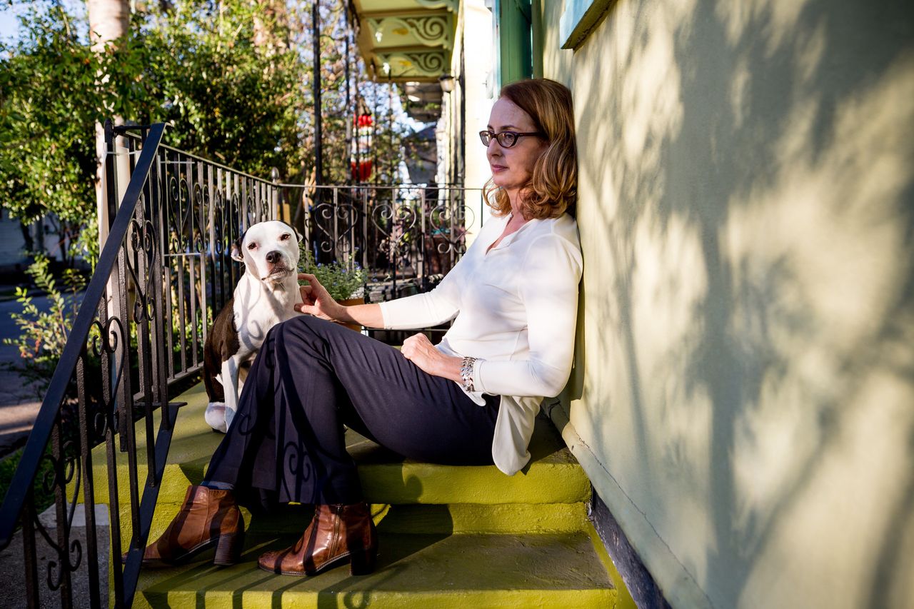 Meg Lousteau sits outside her home in the Treme neighborhood.