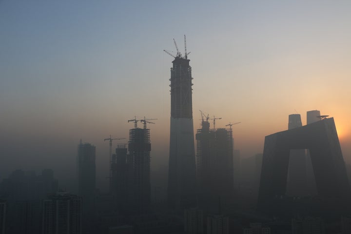 Heavy smog envelops the buildings at Beijing's central business district.