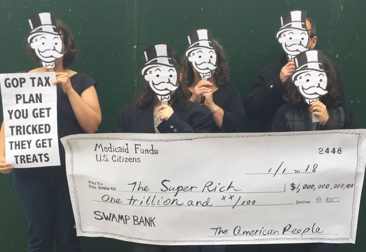 <p>GOP tax protest: Handmade Mr. Moneybags masks, and hand painted checks from Medicaid Funds to the Super Rich are good props for a 2017 tax protest</p>