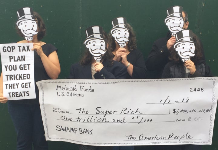 GOP tax protest: Handmade Mr. Moneybags masks, and hand painted checks from Medicaid Funds to the Super Rich are good props for a 2017 tax protest