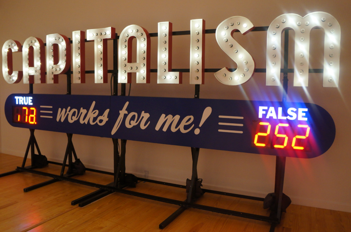 <p><em>Capitalism Works For Me! True/False</em>, 2011 (aluminum and electrical) by Steve Lambert</p>