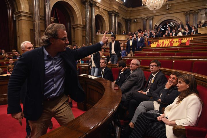 Members of the People's Party of Catalonia leave the chamber before the vote on independence