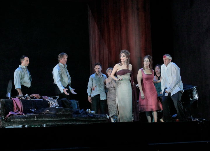 From left, David Adam Moore, Rod Gilfry, Iestyn Davies, Sally Matthews, Audrey Luna, Amanda Echalaz, Christine Rice, and Joseph Kaiser in a scene from “The Exterminating Angel.”