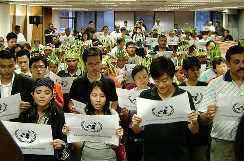 Reading the UDHR on International Human Rights Day, 2007, in Kuala Lumpur, Indonesia (Source: The Public First Program)
