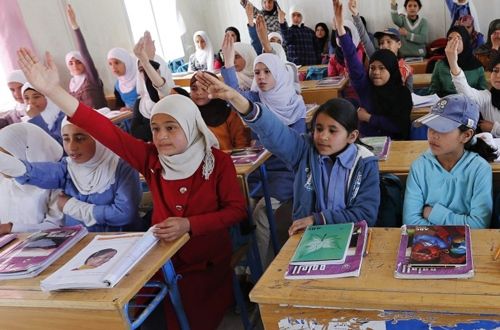 Syrian refugee students attend a class in a UNICEF school at the Al Zaatari refugee camp in Mafraq (Source: Thomson Reuters Foundation)