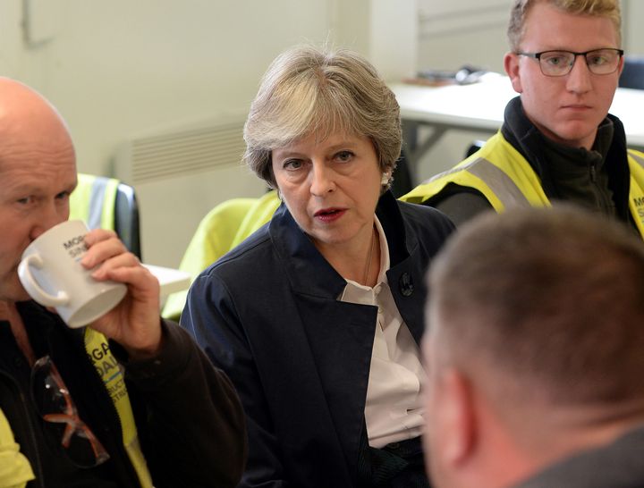 May takes a tea break at a construction site in Old Buckenham, Norfolk earlier this week.`
