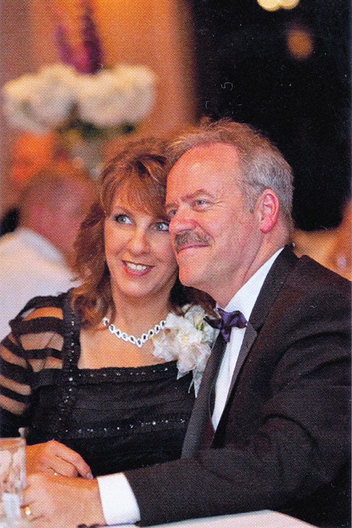 Jim and Leeanne Mills of West Liberty, Ky., celebrate at the 2014 wedding of their daughter. Leeanne Mills died in hospice care in August 2016 after aggressive treatment for ocular melanoma, a type of eye cancer. 