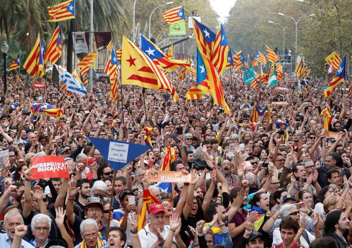 People celebrate in Barcelona after the Catalan regional Parliament there voted for independence from Spain on Friday.