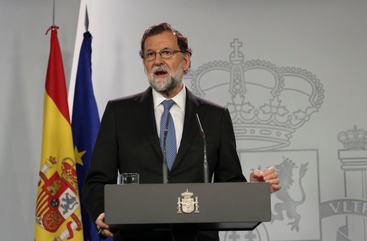 Spain's Prime Minister Mariano Rajoy delivers a statement after an extraordinary Cabinet meeting at the Moncloa Palace in Madrid on Friday.