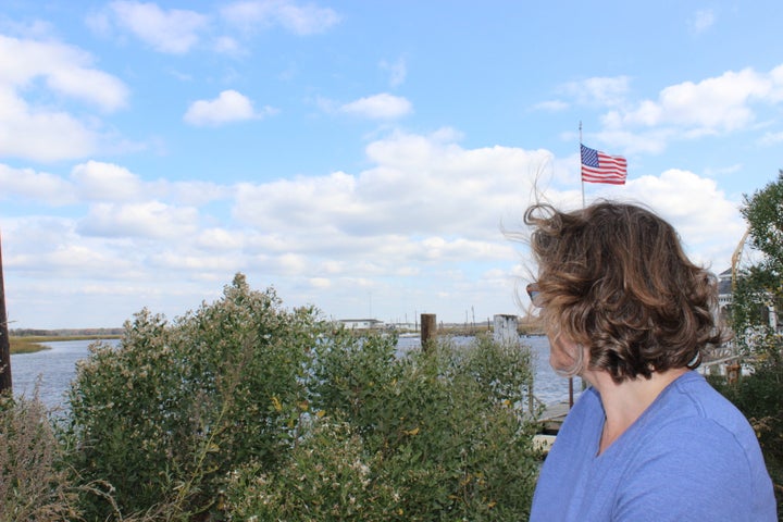 Meghan Wren looks out over the creek behind her home. 