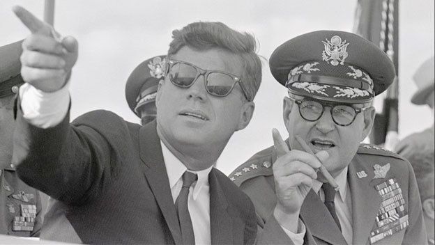 President John F. Kennedy with his principal internal antagonist during the Cuban Missile Crisis, General Curtis LeMay. The Air Force Chief of Staff and founder of the Strategic Air Command stridently urged the bombing of Soviet forces and invasion of Cuba, charging that Kennedy, a World War II Navy hero as a young officer in the Pacific, was weak and cowardly. LeMay’s strategy would likely have triggered the use of nuclear weapons.