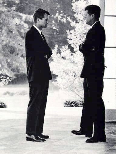 President Kennedy and Attorney General Robert F. Kennedy confer during a break in sessions of ExComm, the JFK-appointed Executive Committee of the National Security Council, which was for all practical purposes the government of the United States during the 13-day Cuban Missile Crisis.
