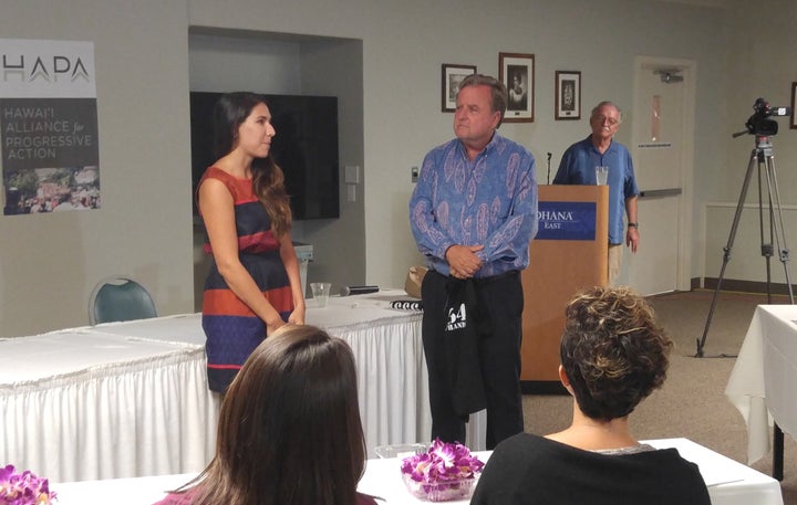 H.A.P.A. Board President, Gary Hooser recognizes Aria Juliet Castillo, a founding Board member and now Program Manager, Kuleana Academy for her organizing efforts before the start of the Forum. Hooser’s own efforts fighting the chemical companies on Kaua`i and calling for greater disclosure of the application of Restricted Use Pesticides was recognized by candidate Josh Green in his remarks about fighting special interests that obstruct good public policy. Looking on is moderator, Chris Vandercook of HPR.