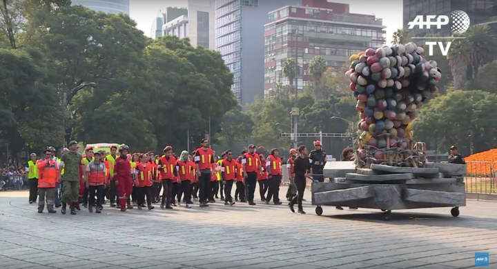 A float honoring rescue workers is seen at the start of Saturday's Day of the Dead parade in Mexico City, Mexico.