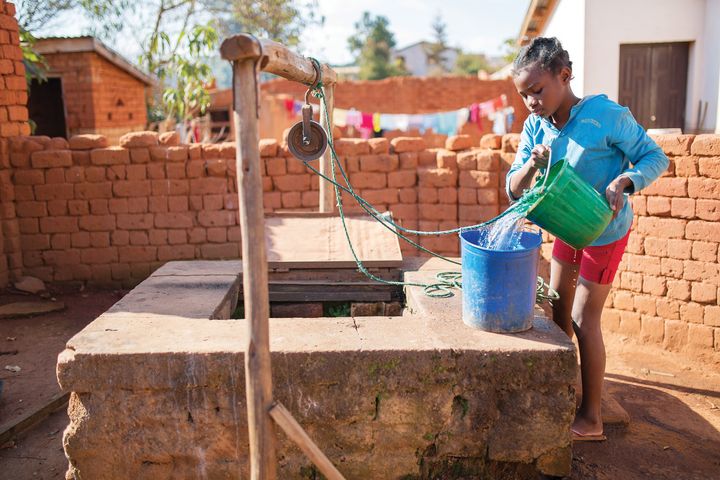 A young girl in the Faravohitra Commune of Anosy Avaratra collects water for her family from a traditional well. Water sources like these are often unsafe and contain high levels of pathogens, leading to recurring illnesses. 