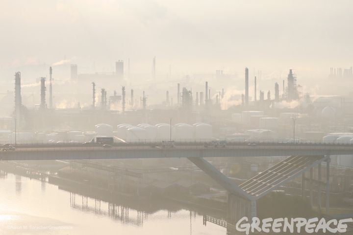 Vehicles make their way across a bridge in haze from the oil refining industrial complex behind them in Manchester, Texas, more than a week after Hurricane Harvey slammed into the area. See more photos.