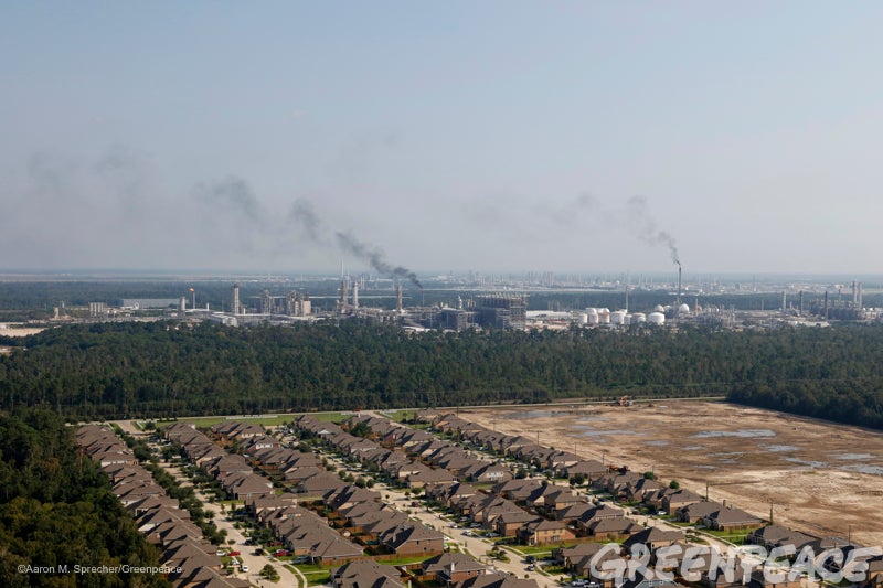 Rows of residential houses sit just across from an industrial refining area still suffering the effect of Hurricane in Southe