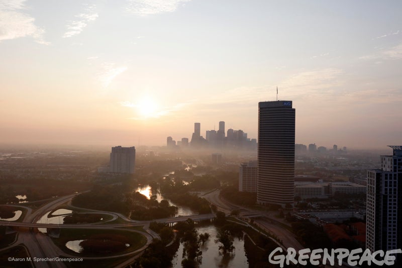 Water still runs at a high level through the Buffalo Bayou in downtown Houston as the sun rises more than a week after Hurric