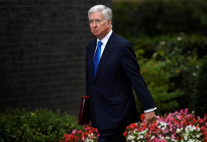 Defence secretary Michael Fallon has apologised for touching journalist Julia Hartley-Brewer's knee