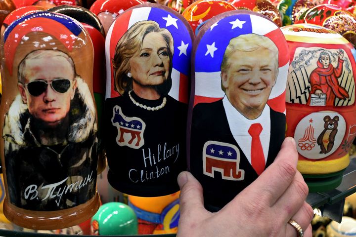Traditional Russian wooden nesting dolls depicting Russia's President Vladimir Putin, US Democratic presidential nominee Hillary Clinton and US Republican presidential nominee Donald Trump on sale at a gift shop in central Moscow on 8 November 2016