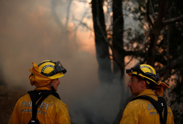 Firefighters work to control a wildfire in Sonoma County on Oct. 14, 2017.