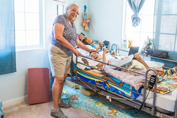 UDW home care provider Wanda Quinones cares for her son Josue in their home in Bakersfield, CA. Wanda cares for Josue, who lives with cerebral palsy, through the state’s In-Home Supportive Services program (IHSS).