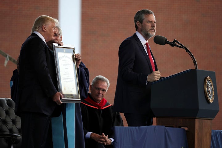 Jerry Falwell Jr. speaks as President Trump is presented with a Doctorate of Laws during a commencement at Liberty University on May 13, 2017, in Lynchburg, Virginia.