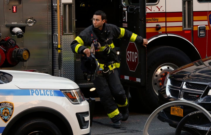 Emergency medical technicians rush to help victims in lower Manhattan.