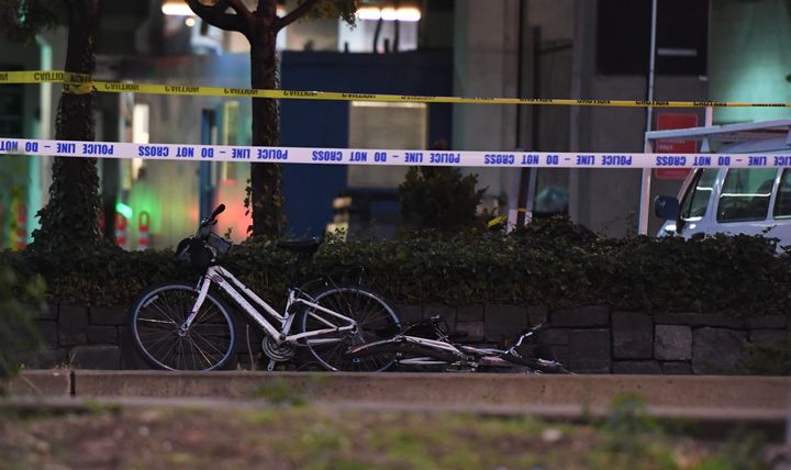 A bicycles lies inside the roped off crime scene