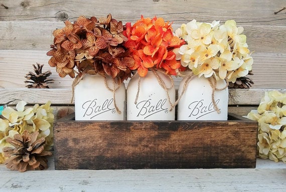 Add a touch of country living to your uban space with <a href="https://www.etsy.com/listing/252148601/fall-table-centerpiecefall?ga_order=most_relevant&ga_search_type=all&ga_view_type=gallery&ga_search_query=thanksgiving%20table%20decor&ref=sr_gallery_20" target="_blank">mason jar centerpieces</a>.
