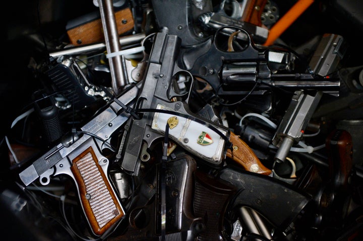 Surrendered handguns are seen during a gun buyback event at Los Angeles Sports Arena in Los Angeles, California May 31, 2014.